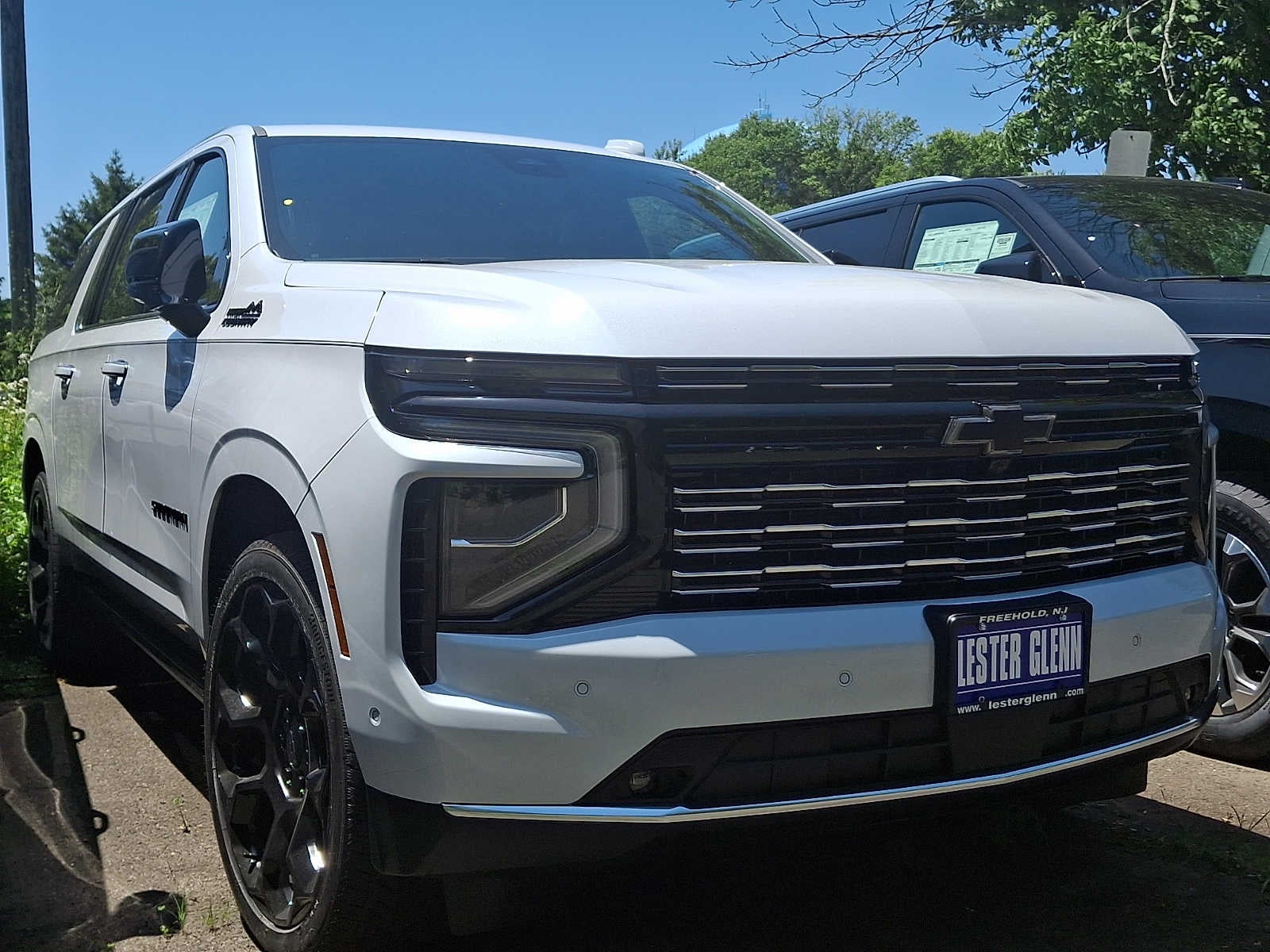 2026 Chevrolet Suburban High Country in Polar White Tricoat — front three-quarter view
